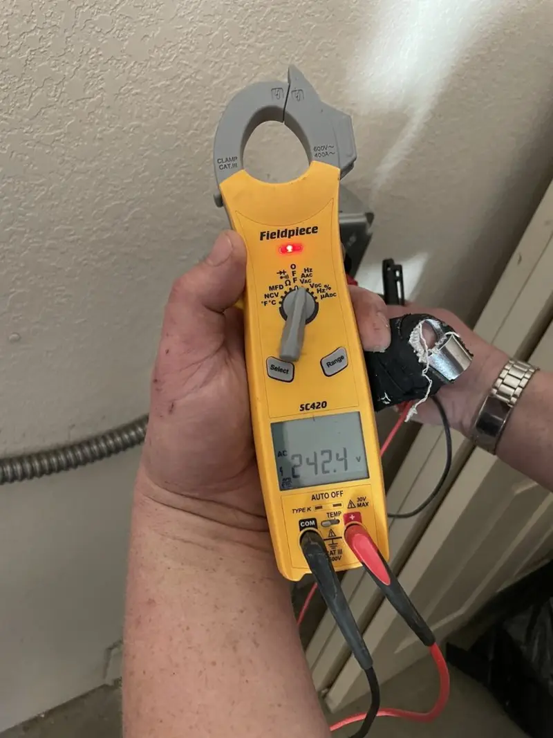 Voltage testing with clamp meter during Electrical Installation Services in Pilesgrove